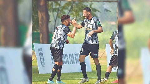 Delhi FC’s Sergio celebrates a goal with Aroldinho