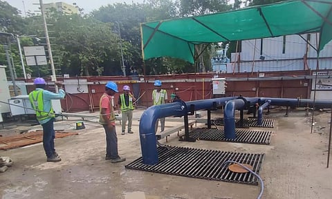 CMRL workers setting up water pumps to mitigate monsoon. (X/@cmrlofficial)