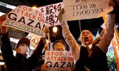People hold a rally to protest against Israel's attack on Gaza near the Israeli embassy in Tokyo (Image: REUTERS)