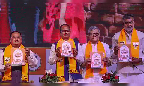 Vision document released by BJP president J P Nadda, Chief Minister Shivraj Singh, BJP state chief VD Sharma and others (Photo: PTI)