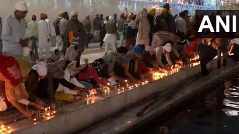 Devotees offer prayers at the Golden Temple in Amritsar on the occasion of Diwali. (Photo/ANI)