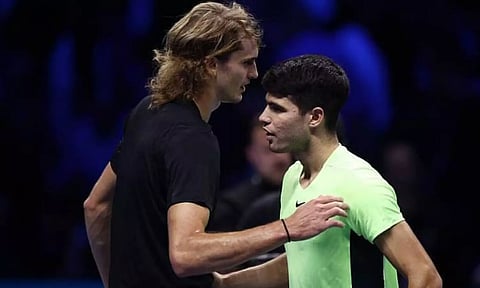 Alexander Zverev (left) with Carlos Alcaraz. (Reuters)