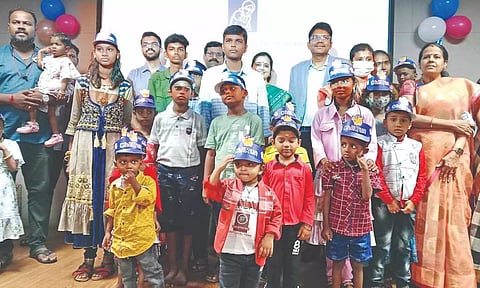 Survivors of bone marrow transplant with their parents