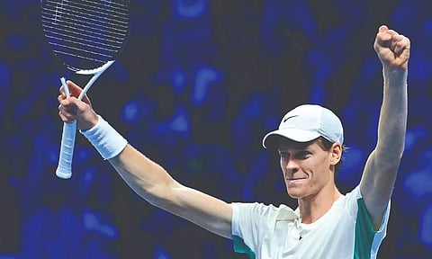 Italy’s Jannik Sinner celebrates after winning his round-robin match against Novak Djokovic