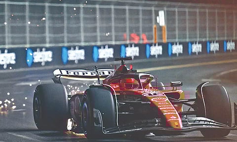 Carlos Sainz’s Ferrari picks up sparks as it cruises past sector 1 in Las Vegas F1 race