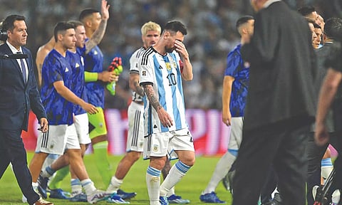 Lionel Messi leaves the field after Argentina’s 14-match unbeaten run was ended by Uruguay in the qualifiers