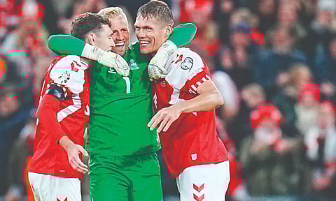 Defenders Andreas Christensen, Vestergaard celebrate with goalkeeper Kasper Schmeichel after Denmark’s qualification