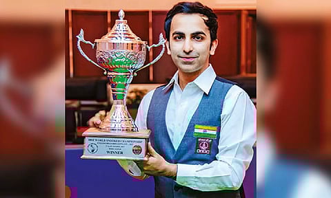 Pankaj Advani poses with the IBSF world championship trophy