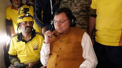 Uttarakhand CM Puhskar Singh Dhami talking to trapped workers in the tunnel (Photo/ANI)