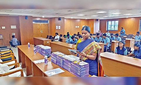 An official checking the tabs to be given to students aspiring to take up NEET in Ranipet on Thursday