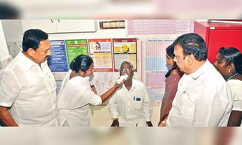 Minister R Gandhi at a community cancer screening camp at the Venketapuram PHC in Sholinghur