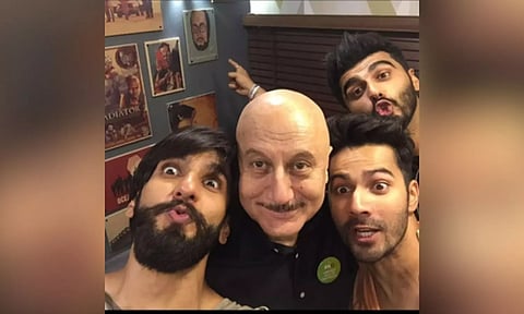Anupam is reminded of ‘Padosan’ as he poses with Varun, Ranveer, Arjun