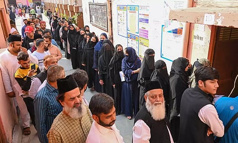 People waiting in queue to cast their votes at a polling booth in Rajasthan. (PTI)