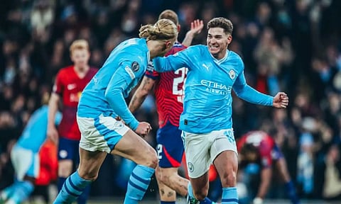 Manchester City players celebrate a goal (ANI)