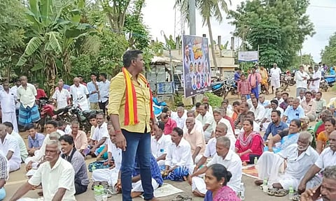 Residents from Keezhakurichi near Pattukkottai block the road on Wednesday demanding action against the accused