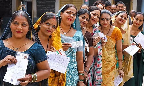 Women waiting in queue at a polling booth to cast their votes. (PTI)