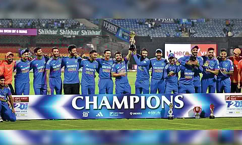 India’s players pose with the series trophy after winning against Australia