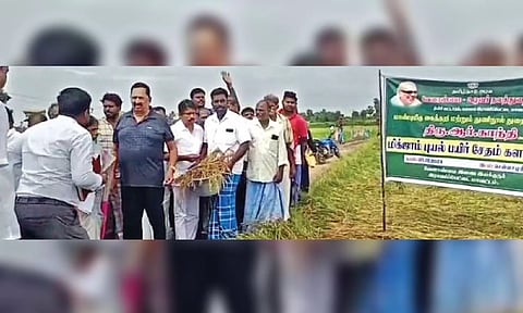 Minister R Gandhi inspecting the crop damages due to Cyclone Michaung in Ranipet on Tuesday