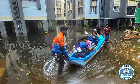 People being rescued in fishing boats (Justin George)