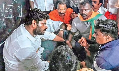 BJP state president K Annamalai interacting with flood-hit people housed at a shelter in Perambur in Chennai on Wednesday