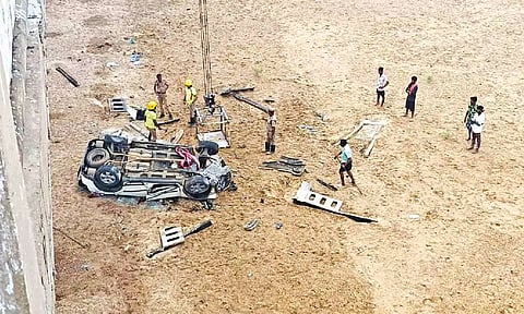 The mangled remains of the car being pulled up from Kollidam on Friday