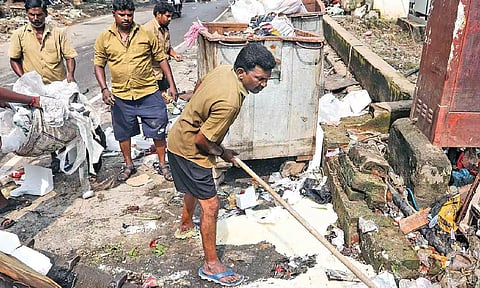 Corporation workers cleaning the debris from one of the roads on Saturday (Photo: Hemanathan.M)