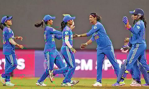 Indian players celebrate the wicket of England’s Amy Jones
