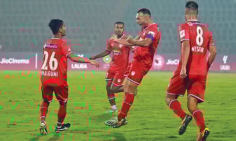 NorthEast United players celebrate their early goal