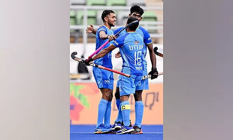Indian players celebrate their win against Canada