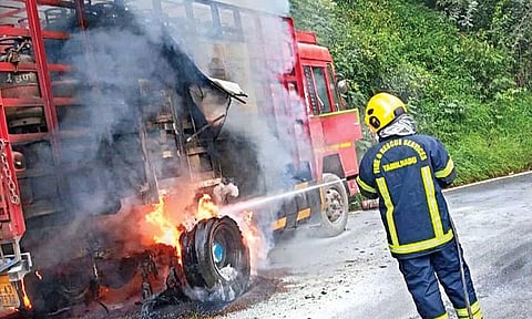 Truck with empty gas cylinders up in flames on the Mettupalayam-Ooty Road, on Tuesday