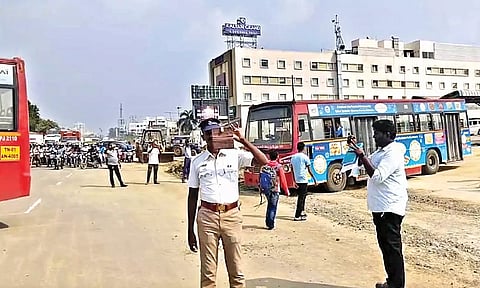 Traffic police conducting a trial run at the entrance of the terminus to check for traffic congestion on NH