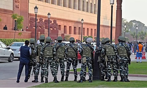 Paramilitary personnel outside Parliament building following a security breach incident. ANI