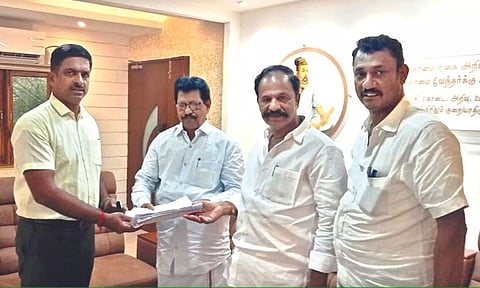 Vellore DMK president Saqhy, MLA Karthikeyan handing over the list to Collector P Kumaravel Pandian on Tuesday 