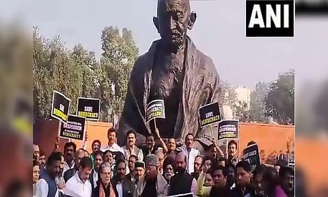INDIA bloc MPs protesting in front of Gandhi statue