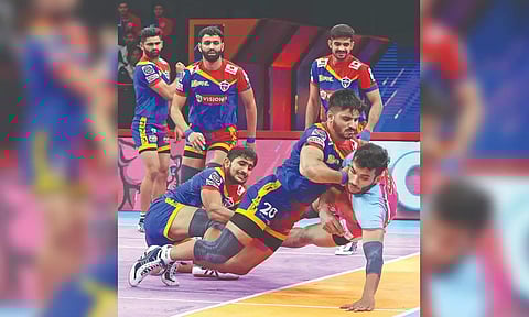 UP Yoddhas players in action against Jaipur Pink Panthers.