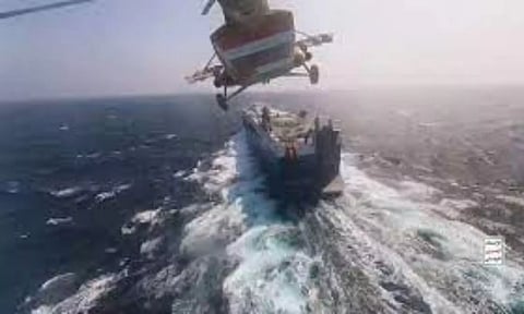 Houthi military helicopter flies over the Galaxy Leader cargo ship in the Red Sea (REUTERS)