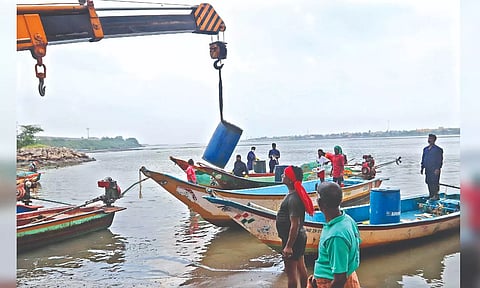 File photo of fishermen cleaning at Ennore Creek. (Photo credit: Hemanathan M)