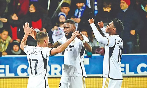 Real Madrid’s Lucas Vazquez, Antonio Rudiger and Aurelien Tchouameni celebrate their win.