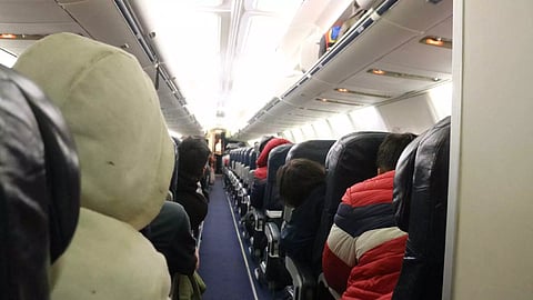 Migrants sit on a plane bound for southern Mexico as part of a repatriation flight to their countries, at the Piedras Negras International Airport, in Piedras Negras, Coahuila state, Mexico (Photo/Reuters)
