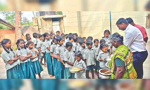 Children get their breakfast at the government-aided school in Thenpalli of Katpadi taluk.