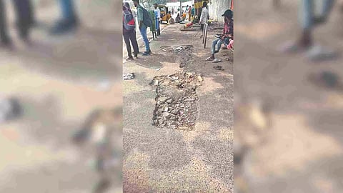 Damaged pavement in front of the Egmore railway station bus stop