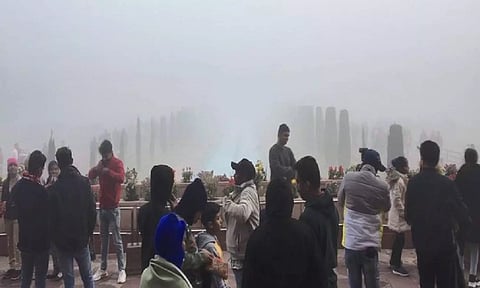 Tourists face difficulties seeing Taj Mahal amid dense layer of fog in Agra (ANI)