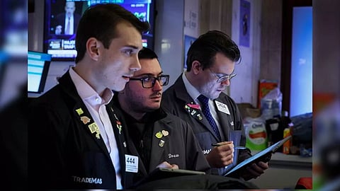Traders work on the floor at the New York Stock Exchange (Reuters) 