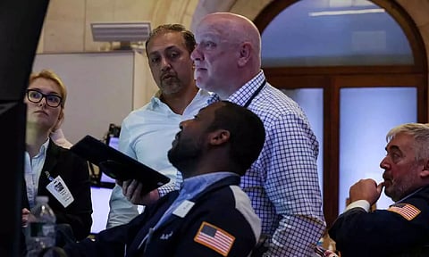 Traders work on the floor at the New York Stock Exchange (NYSE) in New York City, U.S (Reuters)