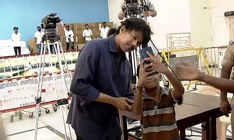 Actor Vijay posing for selfie with a child. (Photo: X/@VijayFansTrends)