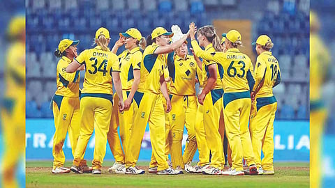 Australian players celebrate their win over India