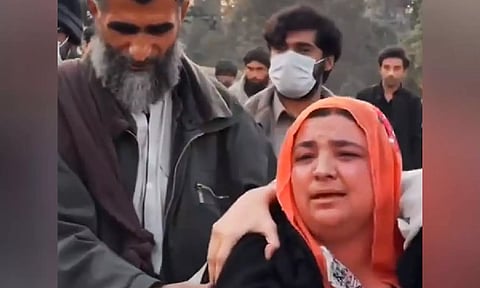 Balaach Baloch's sister during a protest march (X/IFazilaBaloch)