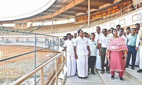 Minister P Moorthy inspects the jallikattu stadium near Alanganallur in Madurai, on Wednesday