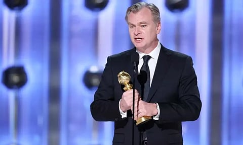 Christopher Nolan with his award at the Golden Globes 2024. (CBS) 