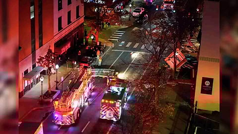 First responders work the scene after an explosion at the Sandman Signature hotel in Fort Worth, Texas (AP)